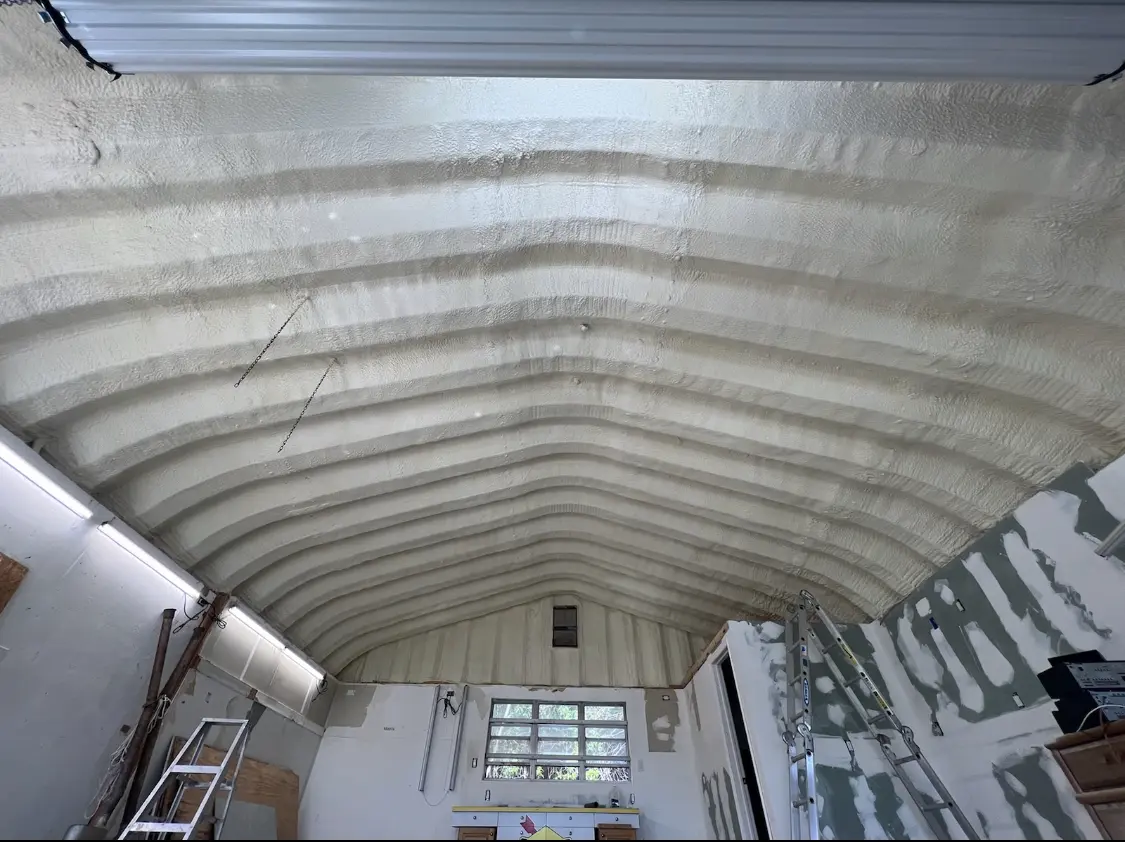 Spray polyurethane foam applied to the underside of a metal roof deck in Paradise